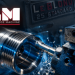 Lowrance Machine logo above a precision metal part being machined on a lathe